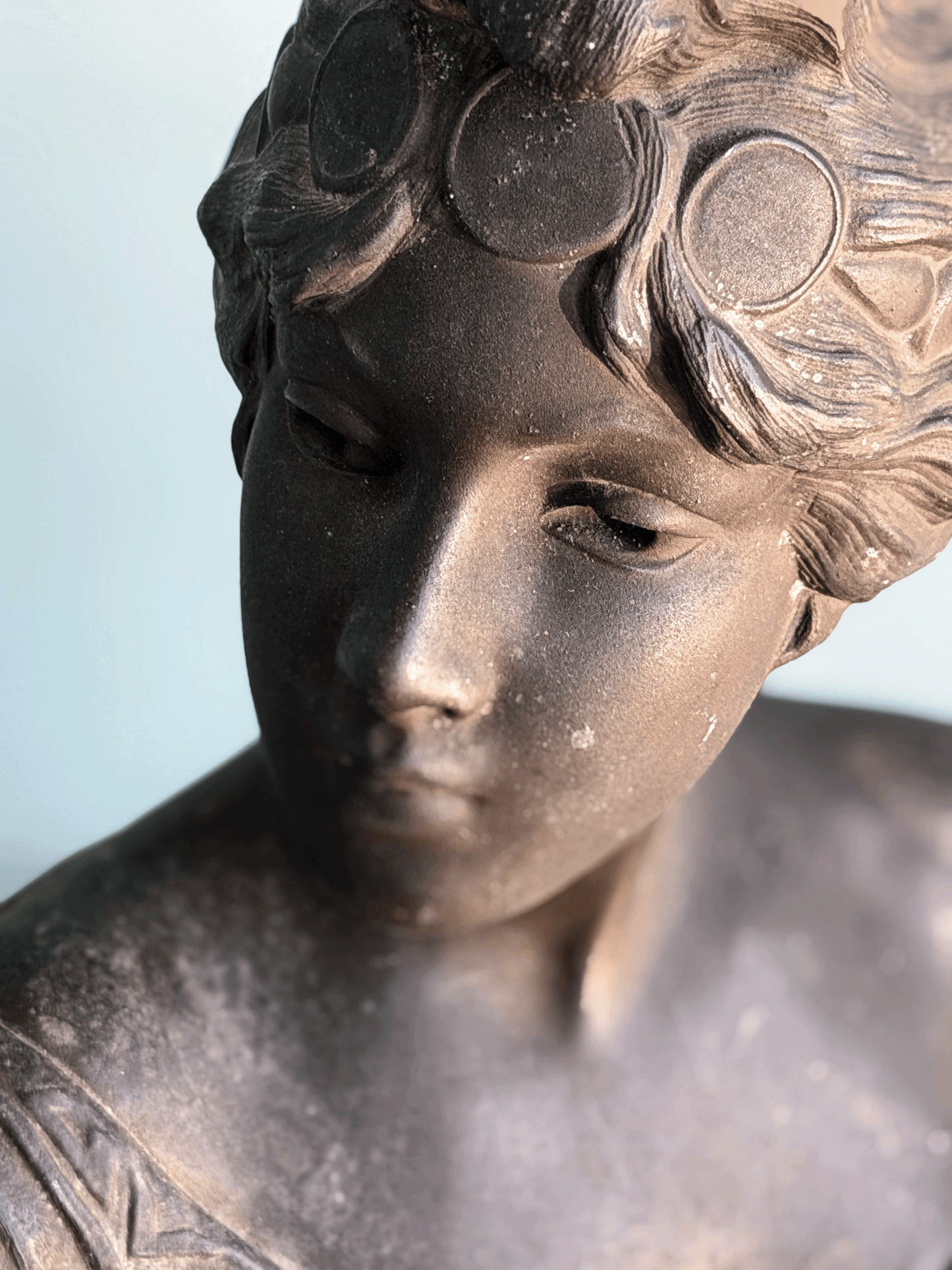 Antique Art Nouveau dark bronze spelter bust sculpture of the Greek goddess Circe with decorative coin headdress.