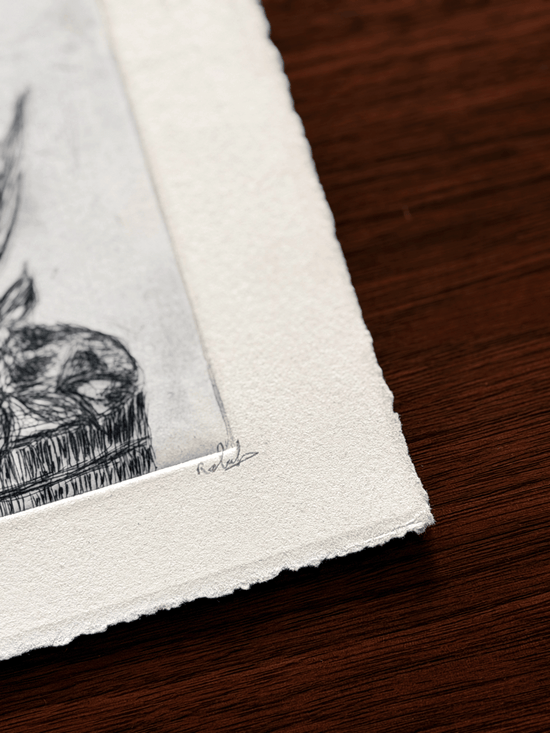 Close-up of artist signature on etching proof of botanicals with plate relief and deckled edge