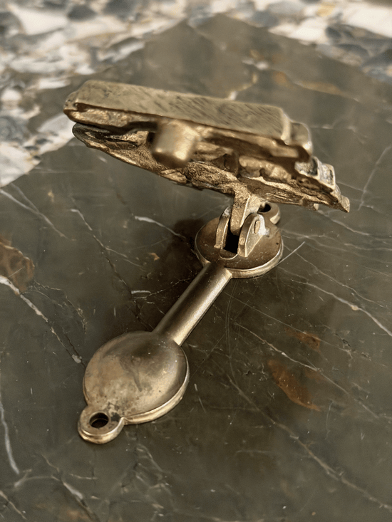 Vintage mid-century solid brass door knocker cast in the shape of the historical Mayflower pilgrim sailing ship, featuring a detailed multi-masted galleon hull with a dark aged patina in the recessed engraving.