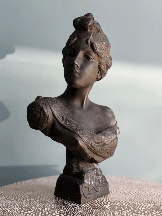 Antique Art Nouveau dark bronze spelter bust sculpture of the Greek goddess Circe with decorative coin headdress.