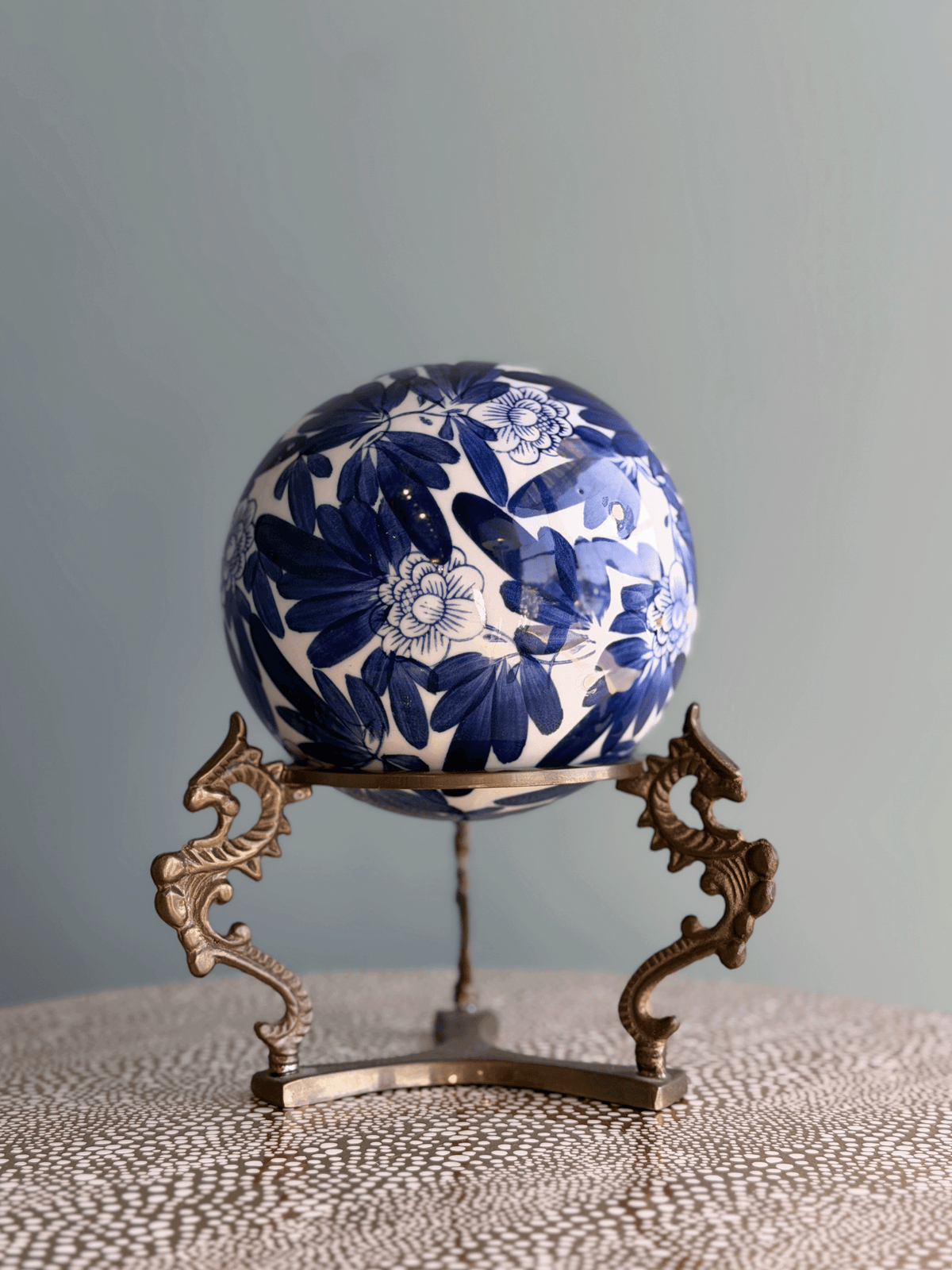 Vintage Large Blue and White Porcelain Chrysanthemum Sphere with Brass Dragon Stand